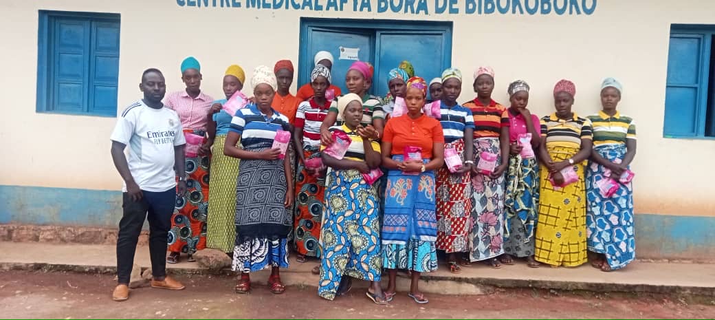 Women gathered together outside a community health center
